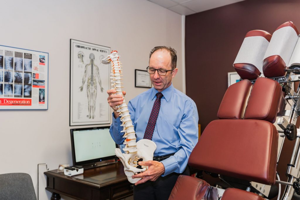  Chiropractor Maryborough Q, Dr James Farmer at Farmer Chiropractic teaching about the spine.