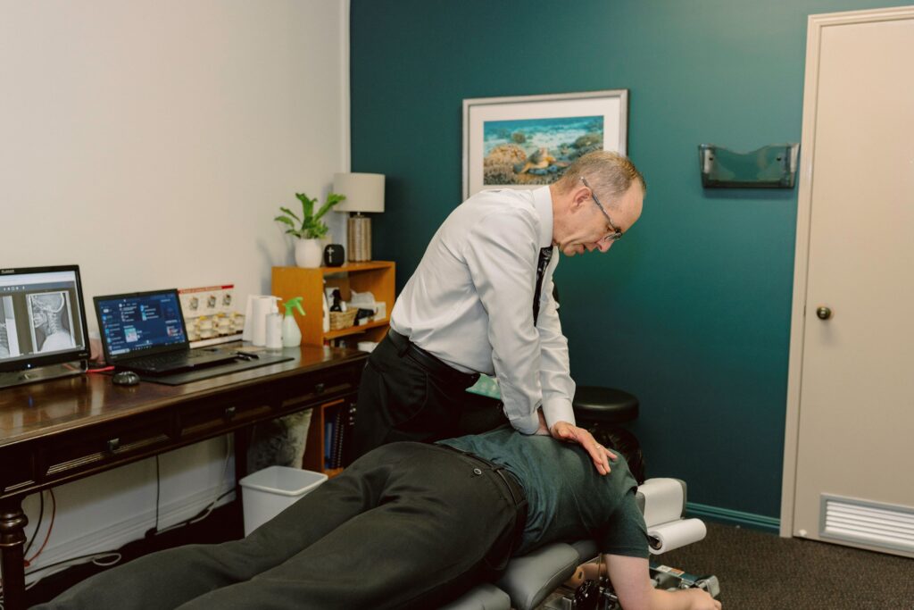 Dr James Chiropractor Adjusting